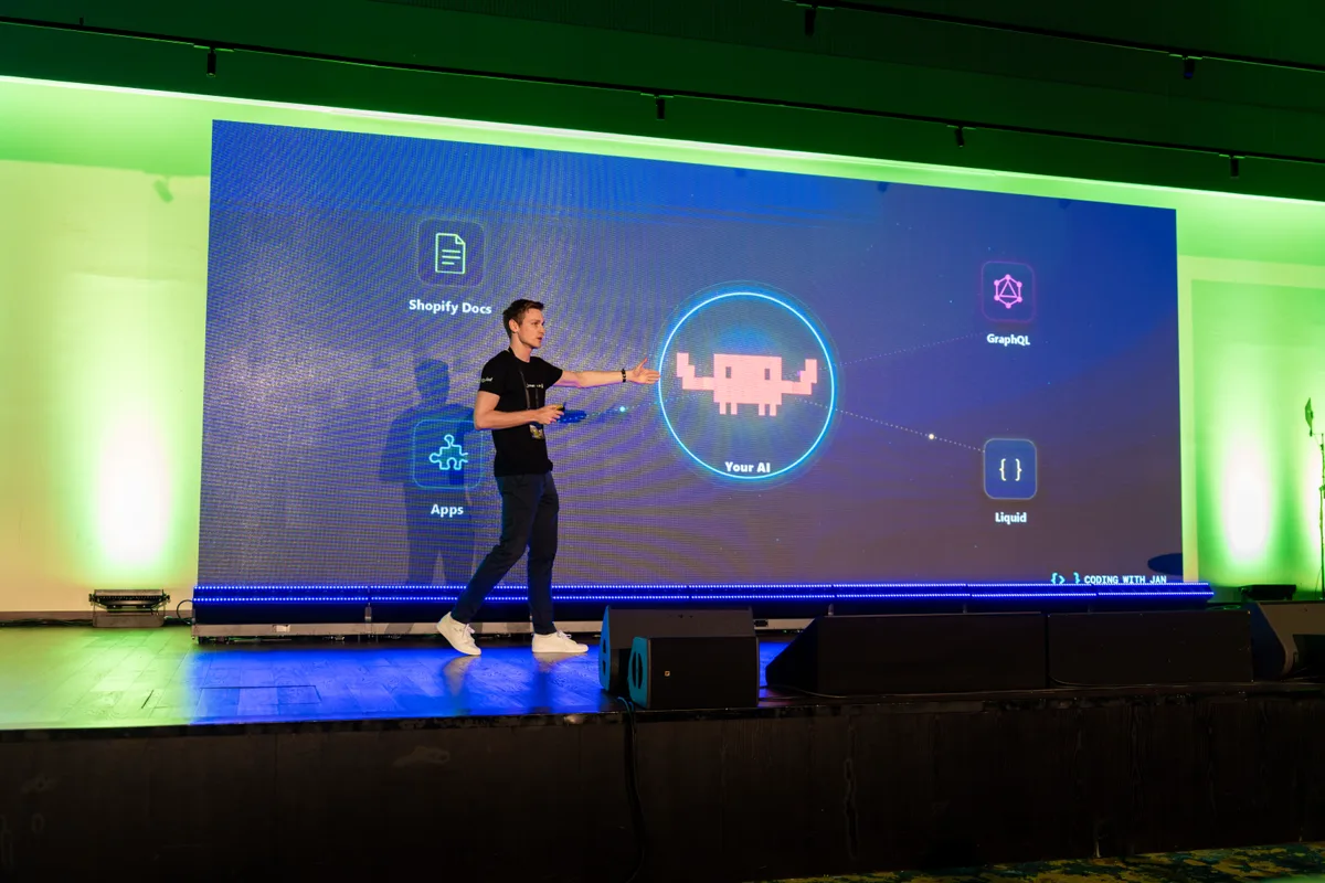 Jan speaking on stage about AI, Shopify apps, Liquid, and GraphQL